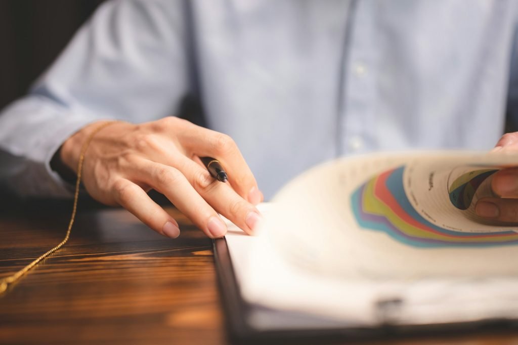 hand stamping with approved stamp on certificate document public paper at desk